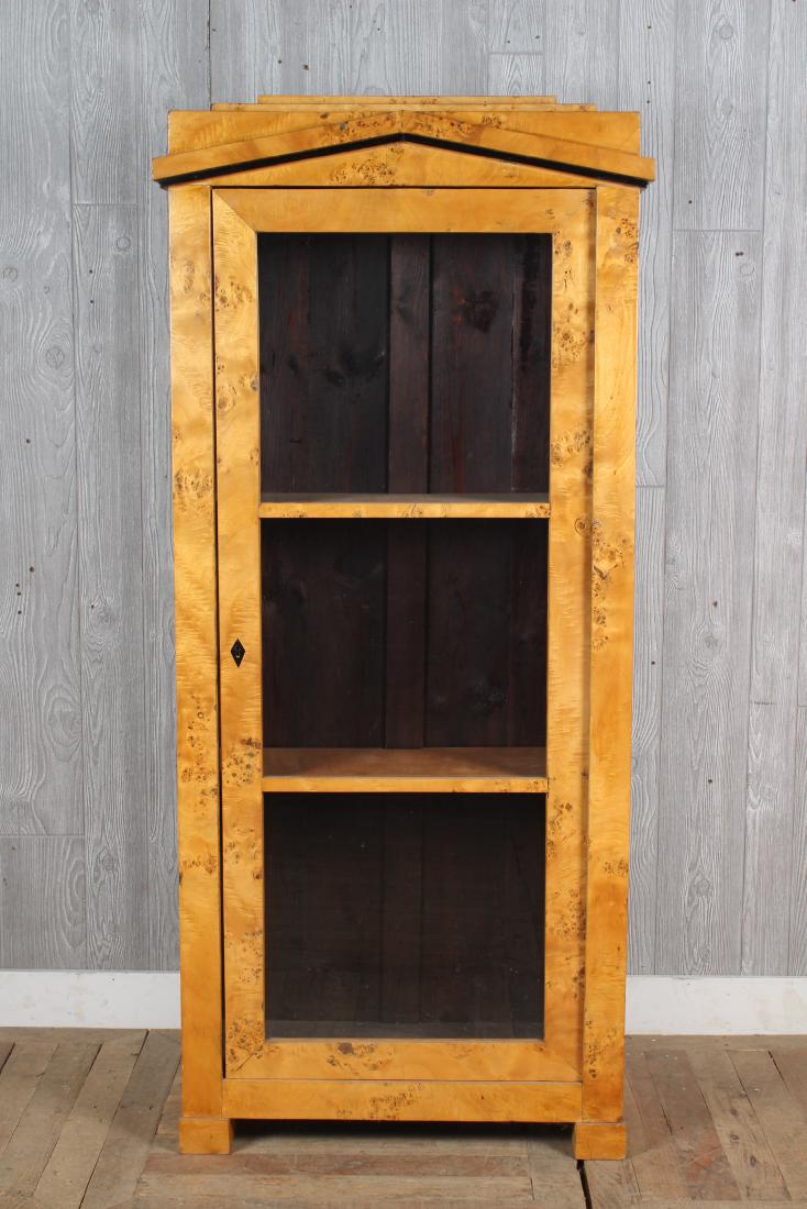 Biedermeier Vitrine: A good Neoclassical Biedermeier vitrine having a pediment top over a glass front single door. Size: 65.5" H x 29.5" W x 12" D