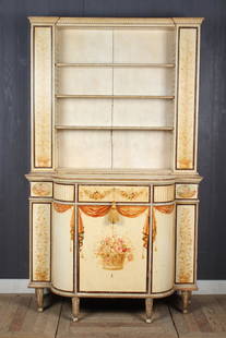 Continental Carved and Painted Bookcase: A Continental carved and painted bookcase having open shelf top over shaped base with French influenced paint decoration. Size: 80" H x 47.5" W x 17" D