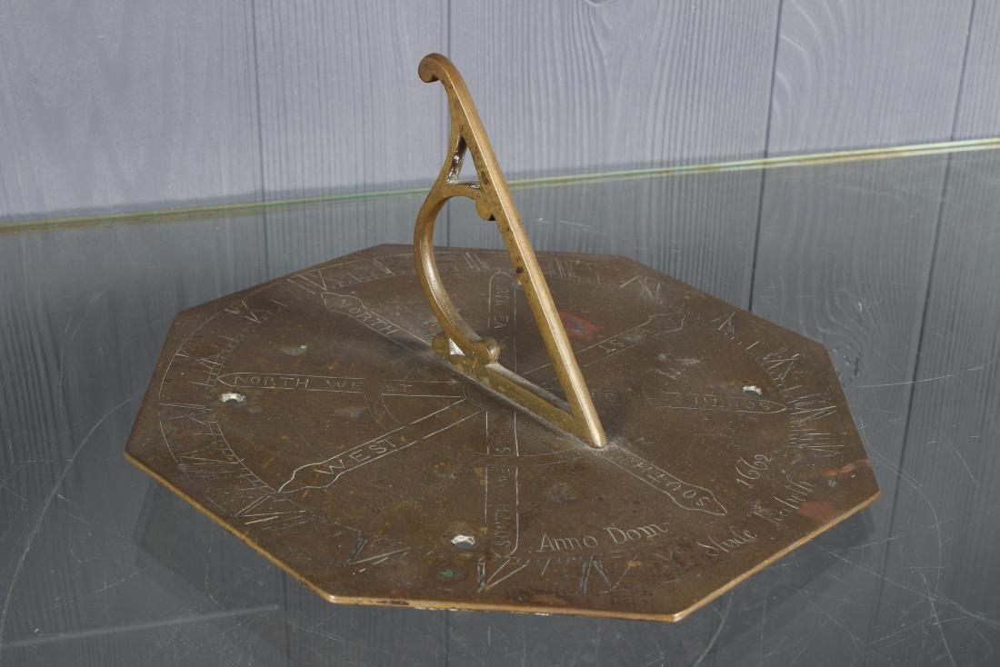 Bronze Sundial: Bronze Sundial. Anno Dom 1662, "Ye Shade Teecheth". Size: 5" H x 10" W x 10" D