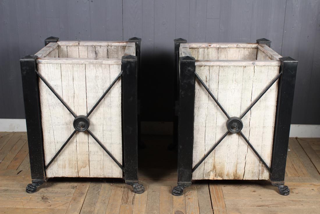 Pair Wood and Iron Planters: Pair Wood and Iron Planters with cast iron paw feet. Size: 34" H x 29" W x 29" D