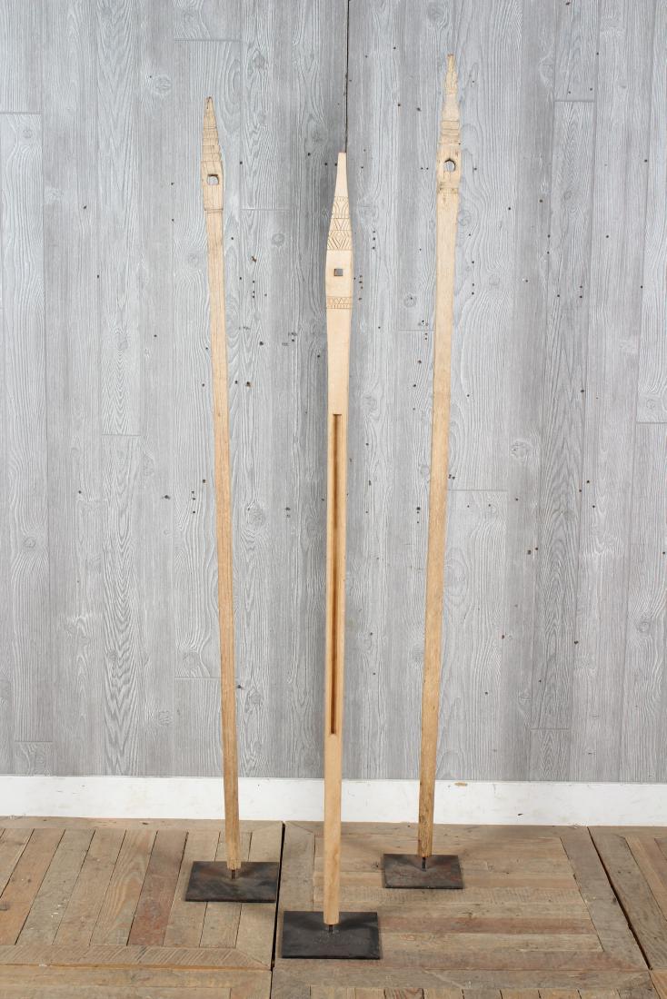 3 Primitive Carved Wood Spires: 3 Primitive Carved Wood Spires. Size: Largest: 73" H x 7" W x 7" D