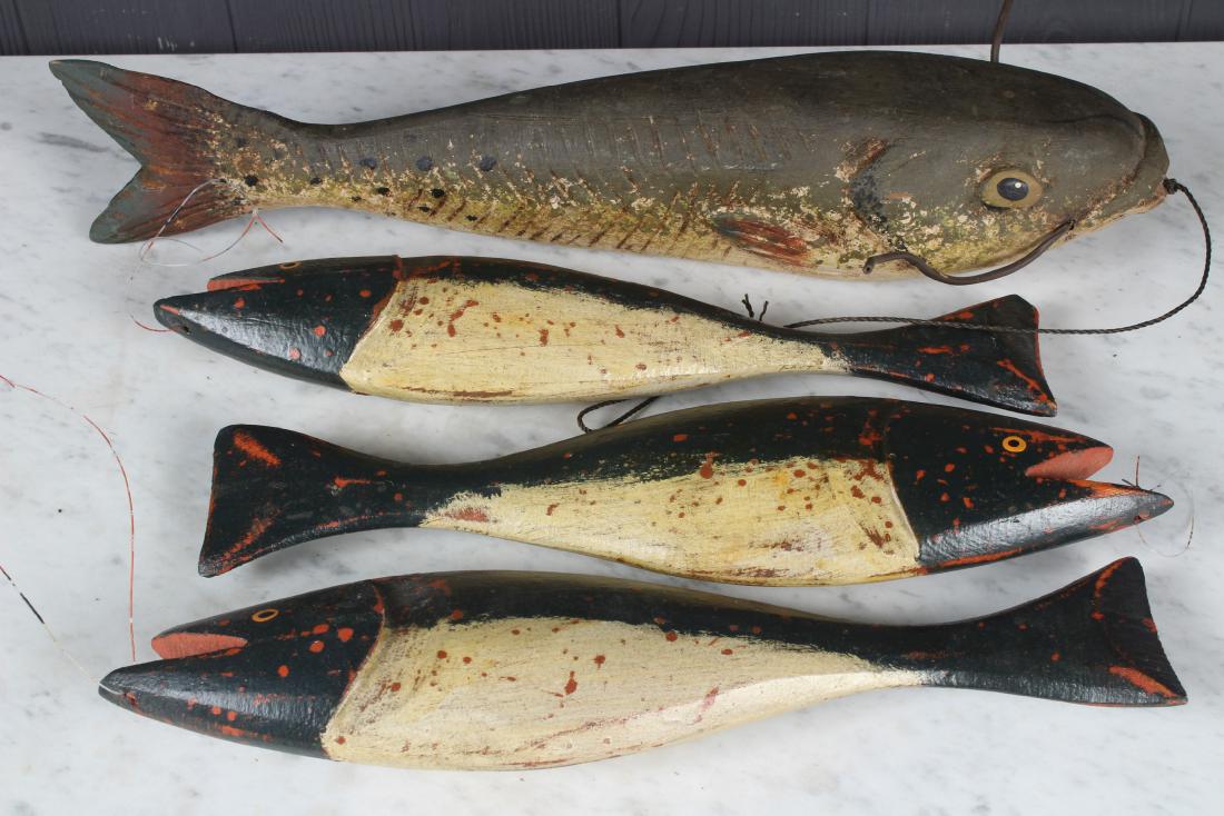 4 Carved and Painted Fish Decoys: 4 Carved and Painted Fish Decoys, one signed Randy Hofman with Ixoye fish stamp. Size: Largest: 3" H x 15" W x 4" D