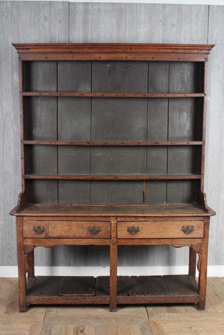 Antique 19th C Welsh Dresser: An early 19th century Welsh dresser having open shelf top resting on lower case with drawers. Size: 79" H x 60" W x 17" D