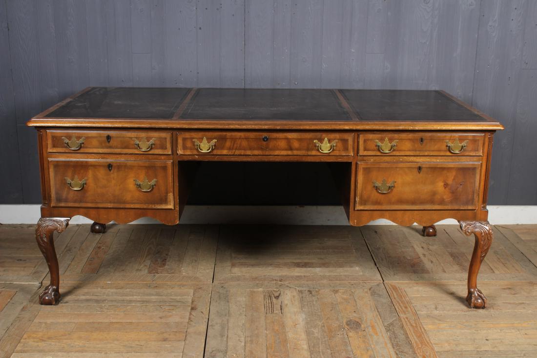 Labeled Kittinger Desk: Labeled Kittinger Desk, 3 panel tooled leather top, center drawer flanked on both sides by two drawers, labeled Kittinger Pattern T432 - L. H. Faux partners desk. Size: 31" H x 73" W x 37" D