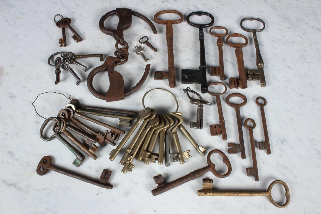 Large Lot Small Skeleton Keys: Large Lot Small Skeleton Keys. Approximately 38 keys and a pair of cuffs. Size: 1.5" - 7.5" Long