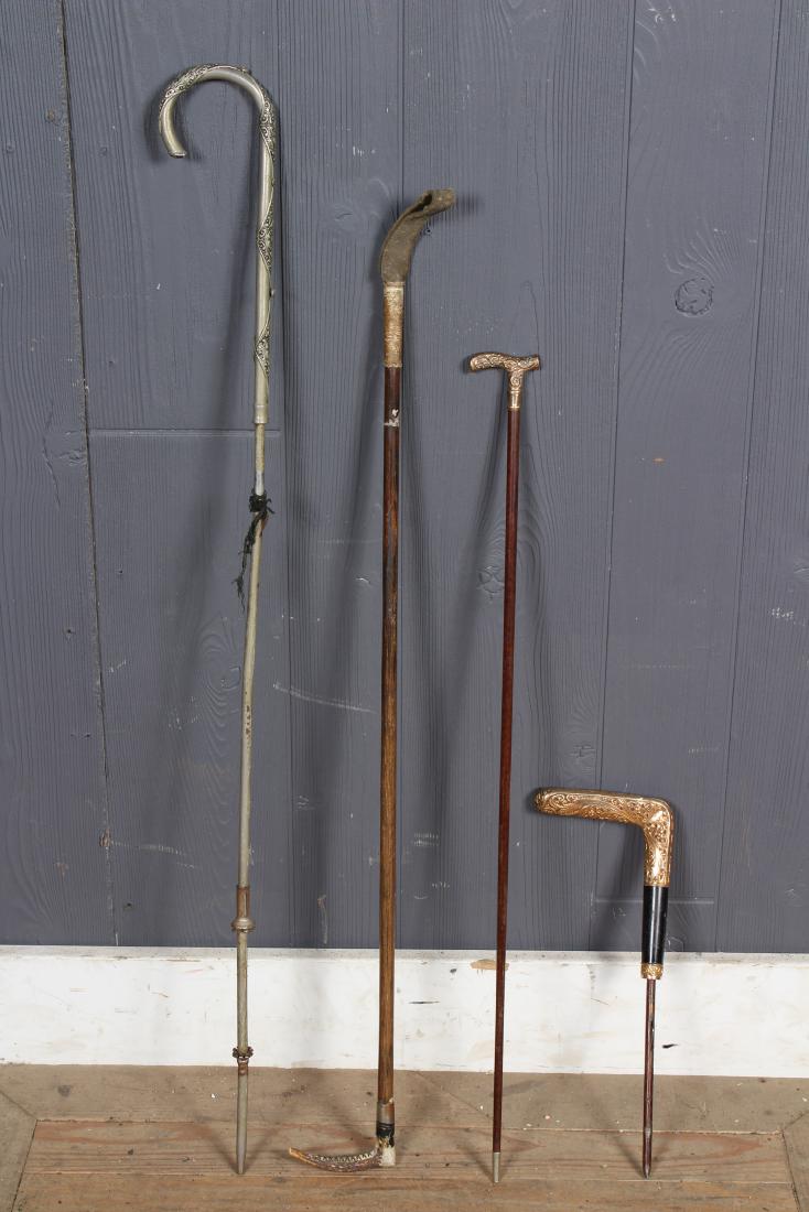 Lot of Parasol Handles and Riding Crops: Lot of Parasol Handles and Riding Crops, includes one with a gold filled handle, monogrammed J.L.C, one with gold filled repousse handle, one steel handle with purple colored cabochon at tip, and a ri