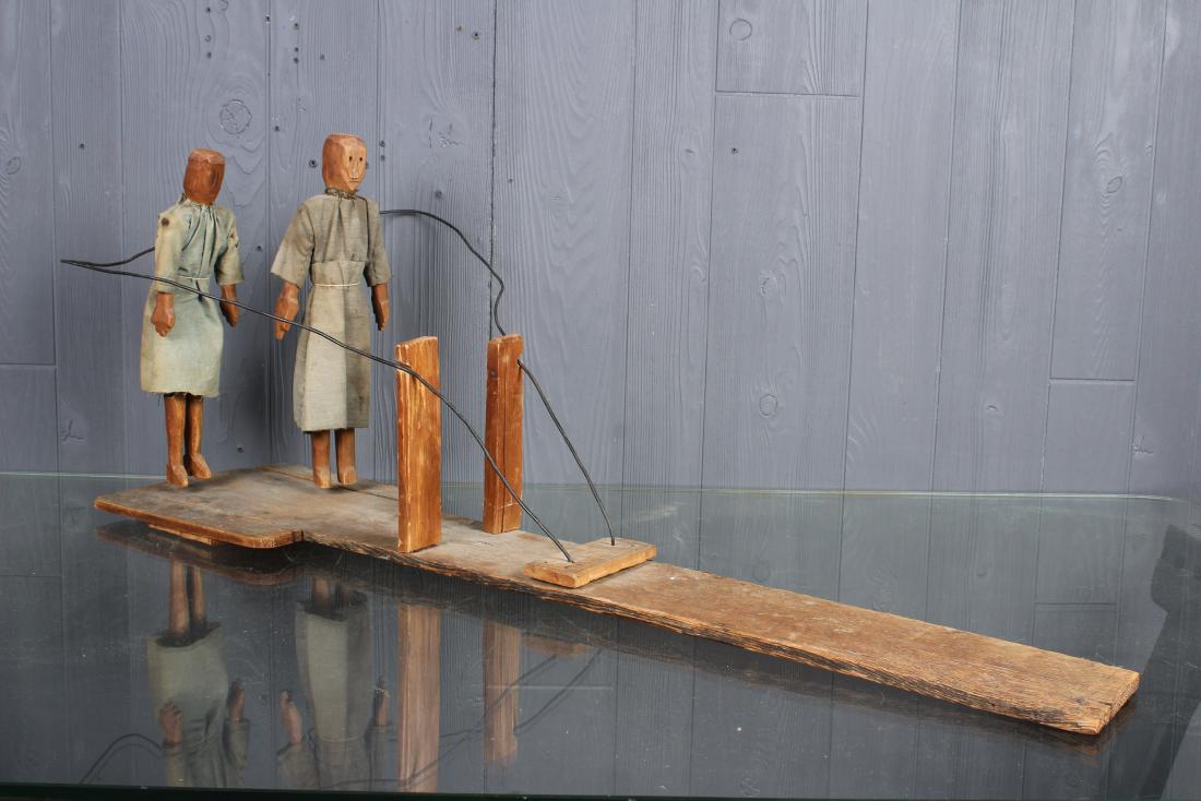 Folk Art Carved Wood Limberjills: A set of carved wood and flock dressed limberjills. Possibly Mennonite or Amish. Size: 15" H x 37.5" W x 10" D