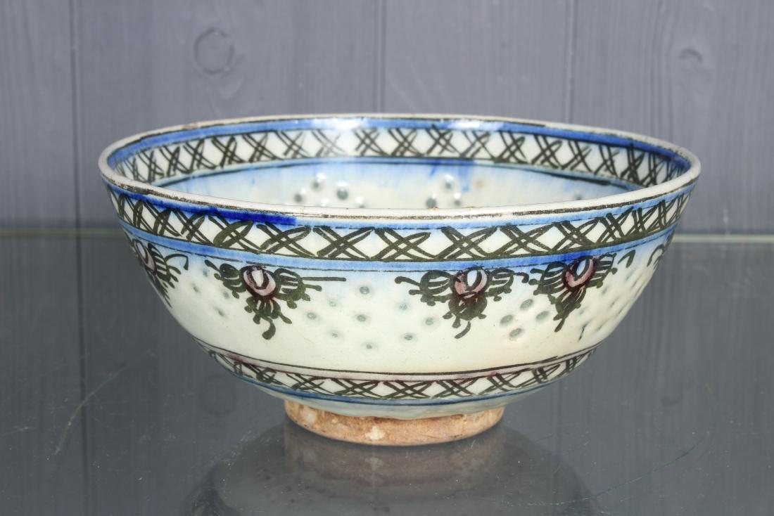 Possibly Persian Glazed Earthenware Bowl: A possibly Persian glazed earthenware bowl with multicolor glaze and perforations. Size: 4" H x 8" W x 8" D