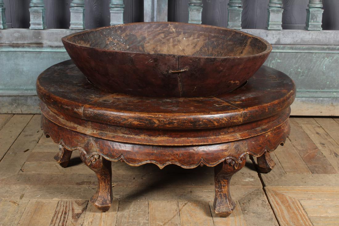 Associated Chinese Table and Dough Bowl: Associated Chinese Table and Dough Bowl. A marriage of cultures represented by an ornate Chinese table base made of elm or perhaps zitan and paired with an primitive American dough bowl. As found. Siz
