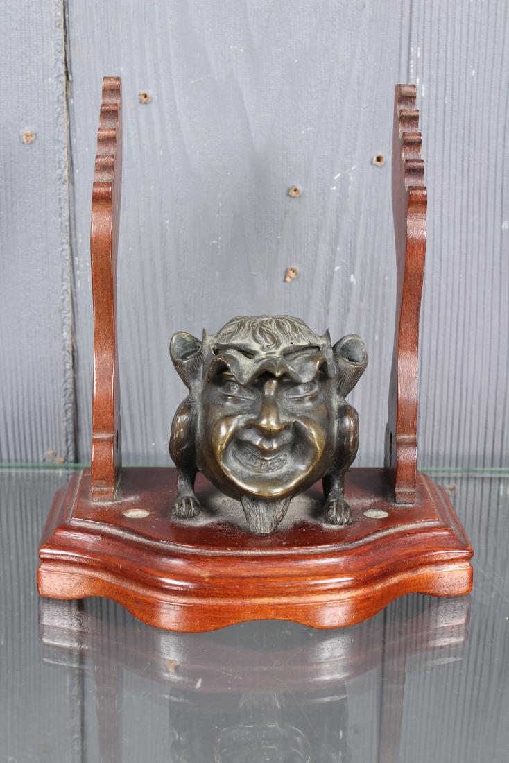 Bronze Imp Ink Well: Bronze Imp Ink Well, devil/ imp, two pen holders, does not have glass insert. Mounted on wooden base. (repair to one foot). Size: 7" H x 6.5" W x 3.5" D