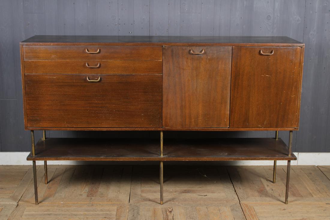 Harvey Probber Sideboard: Harvey Probber Sideboard having 4 doors over a lower tier shelf, supported on metal base, fitted interior. Size: 43.5" H x 70.5" W x 19" D