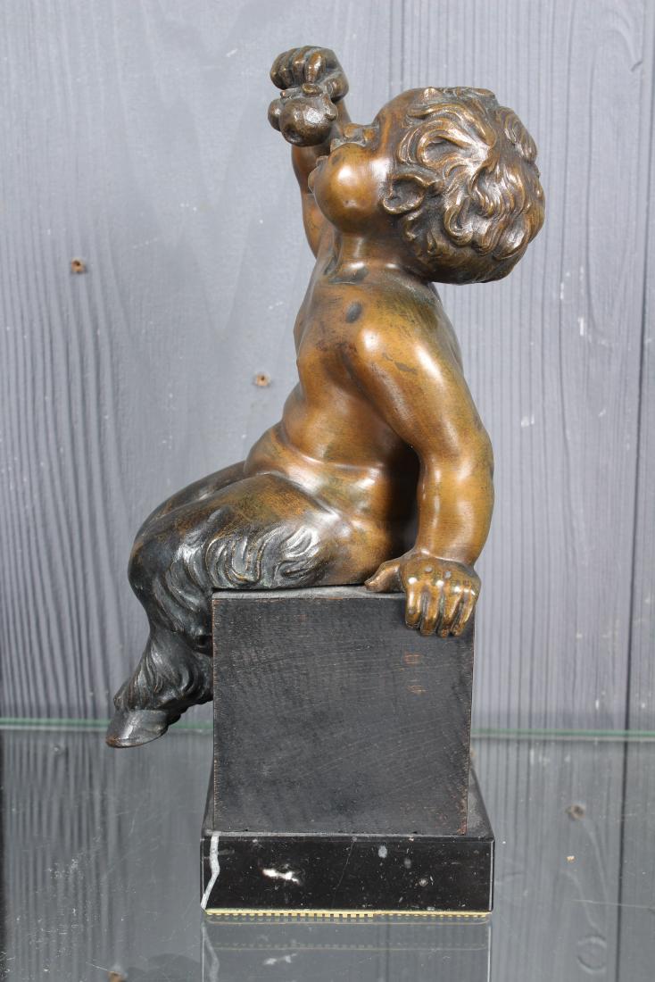 Bronze Seated Faun: Bronze Seated Faun, seated on a pedestal base. Size: 9.5" H x 3.5" W x 4.5" D
