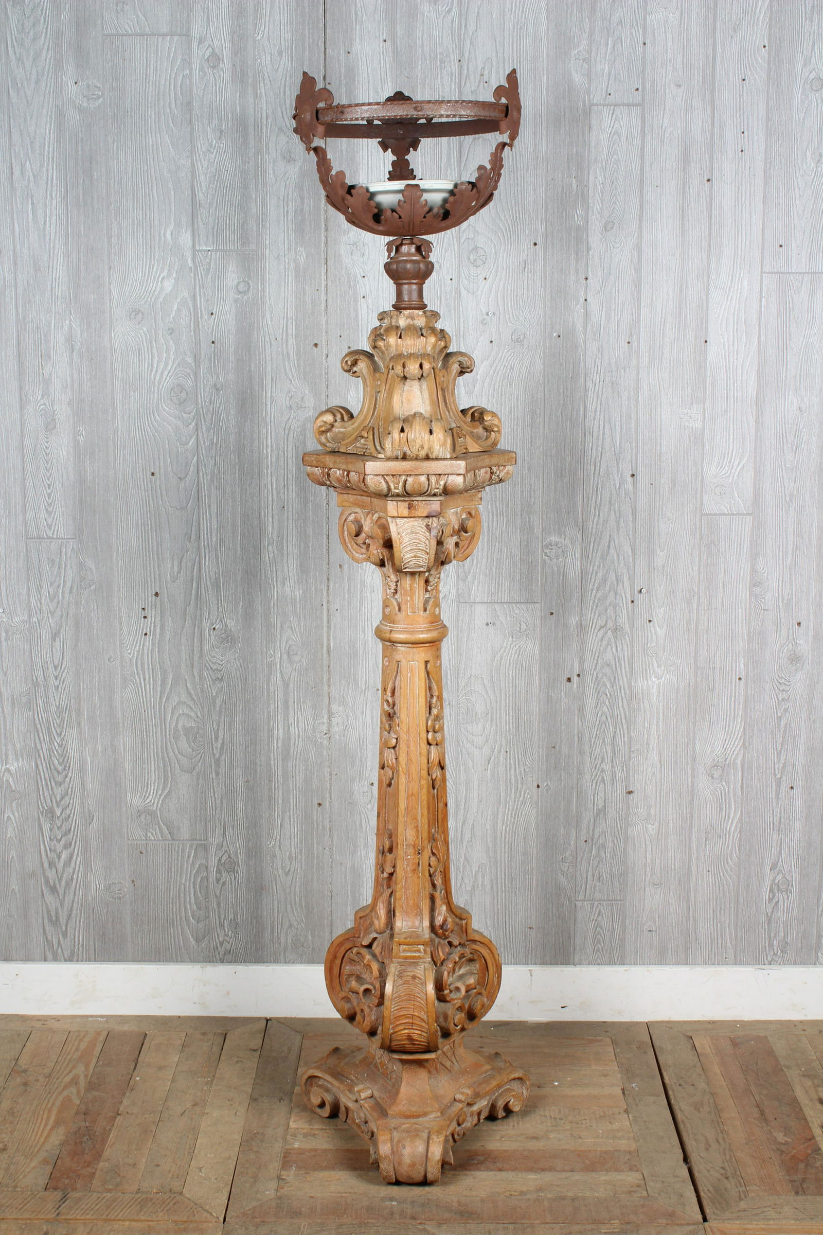 Antique Spanish Torchiere: A late 19th C. Continental wrought iron and carved wood torchiere. Size: 70.5" H x 13" W x 13" D