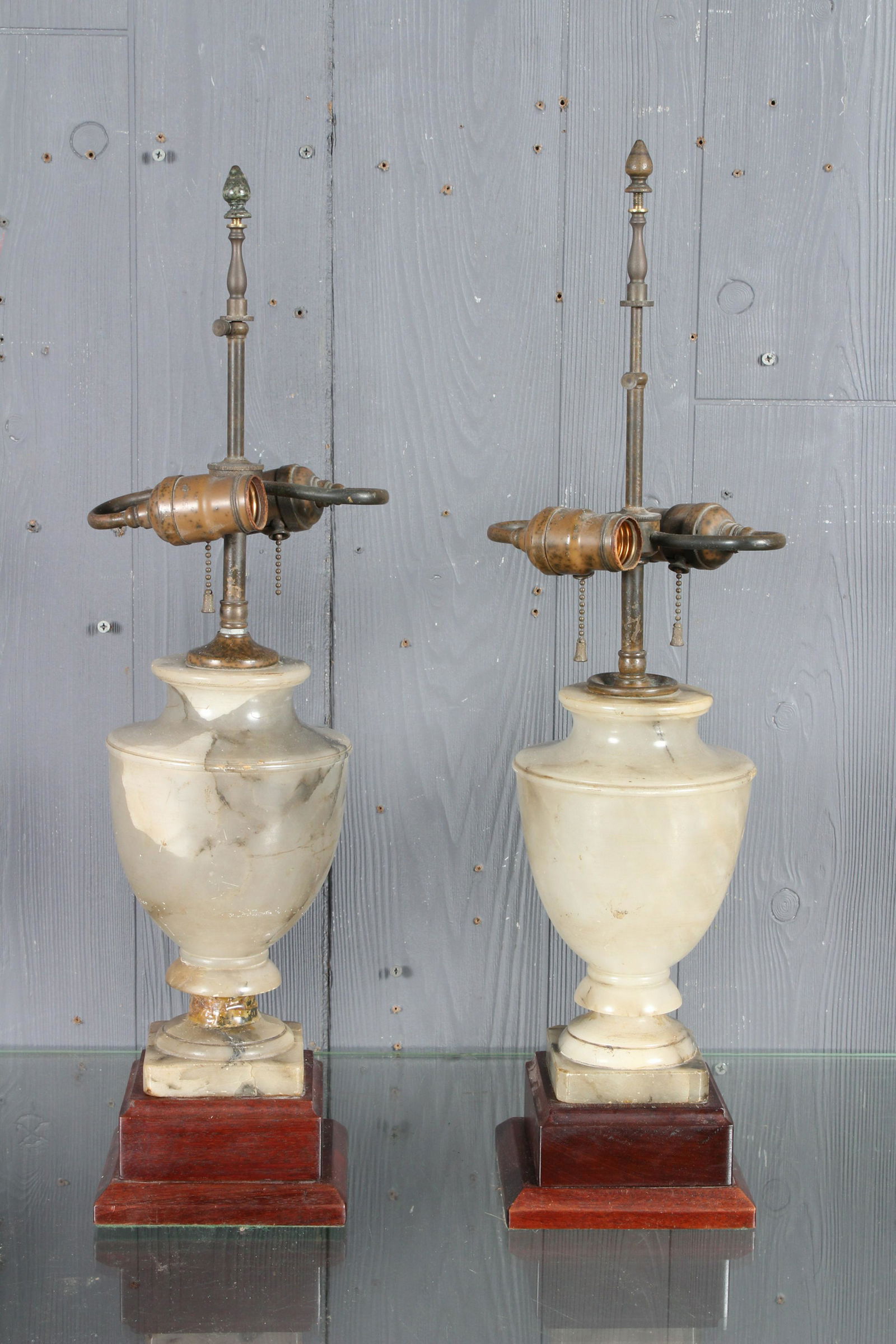 Pair Onyx Urn Form Lamps: Pair Onyx Urn Form Lamps, double socket, mounted on wooden base. Size: 23" H x 6" W x 6" D