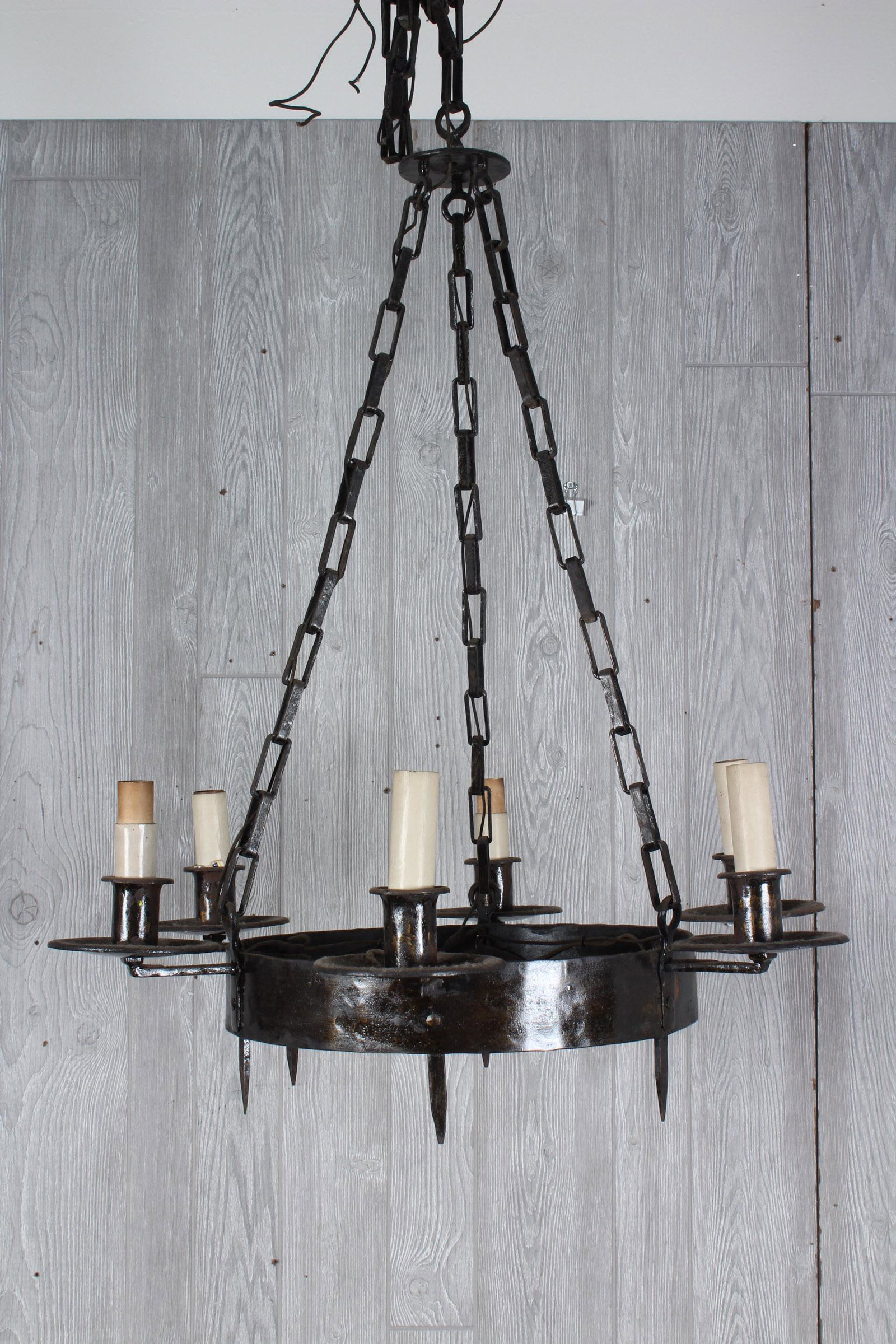 Gothic Style Pendant Wrought Iron Chandelier: An early 20th century Gothic style wrought Iron hanging chandelier. Size: 34" H x 28.5" W x 28.5" D. Due to the nature of the size and scale of these items, preview is strongly recommended. Please not
