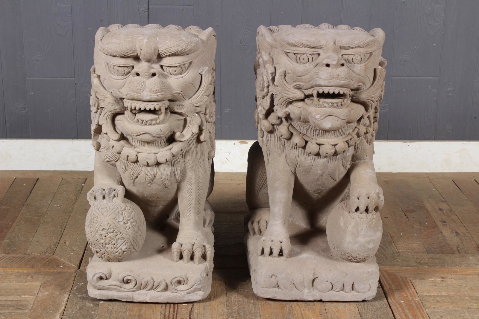 Pair of Carved Stone Foo Dogs: Pair of Carved Stone Foo Dogs. Size: 25" H x 11.5" W x 16" D