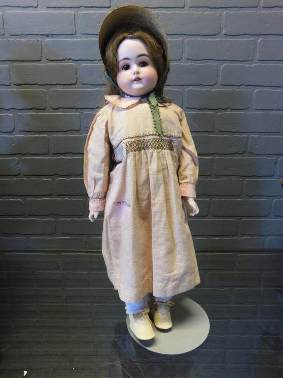 Turned Bisque Shoulder Head Doll: Turned Bisque Shoulder Head Doll, bisque lower arms, kid body, brown glass sleep eyes, painted upper and lower lashes, eyebrows, open mouth with accented lips and upper teeth, incised on head L. Measu