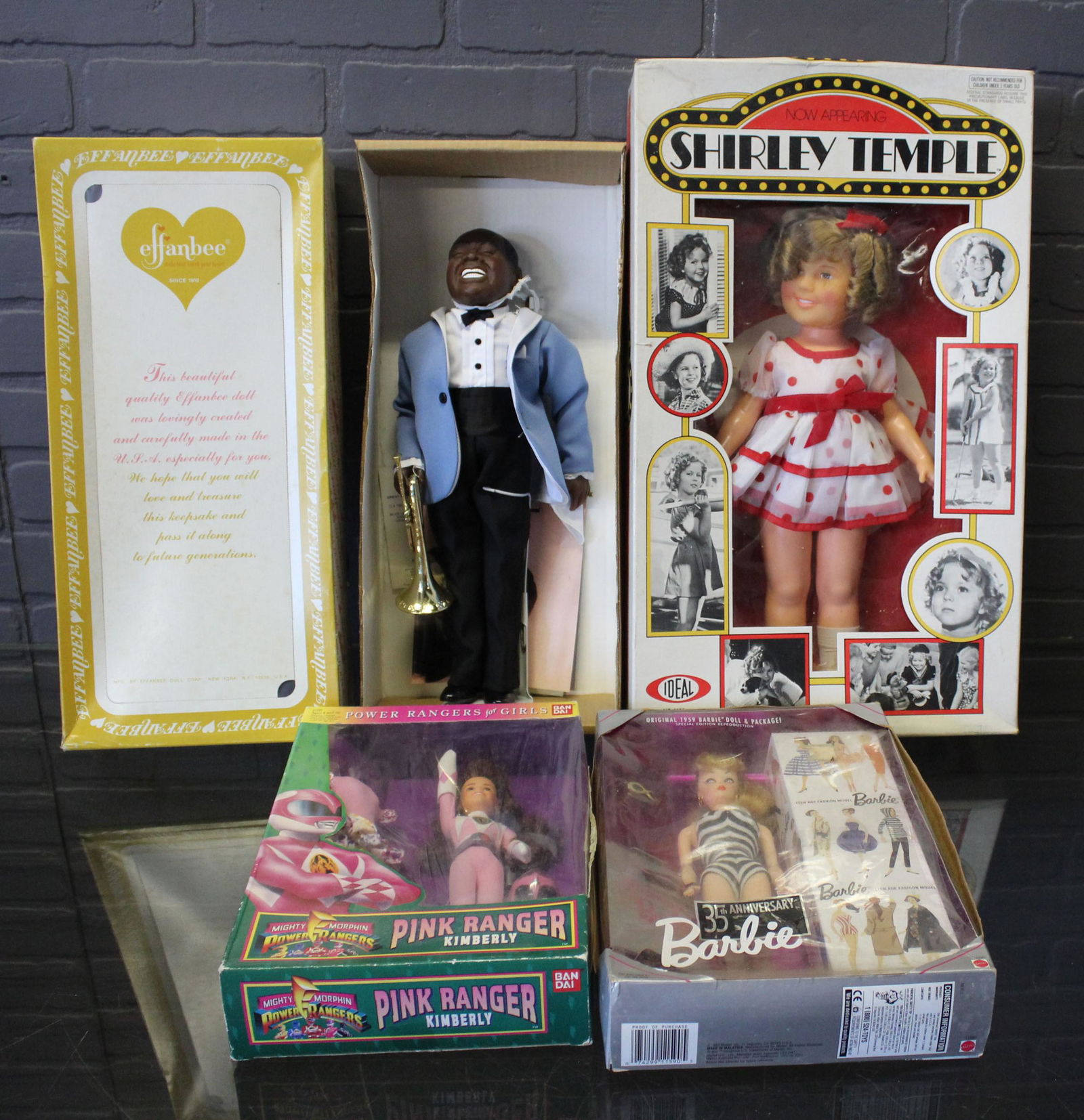 Assorted Dolls New in Original Boxes: Assorted Dolls New in Original Boxes, includes an Ideal Shirley Temple No. 1125, copyright 1973, Effanbee Louis Armstrong 7661, Mighty Morphin Power Rangers Pink Ranger Kimberly by Bandai, and a Barbi