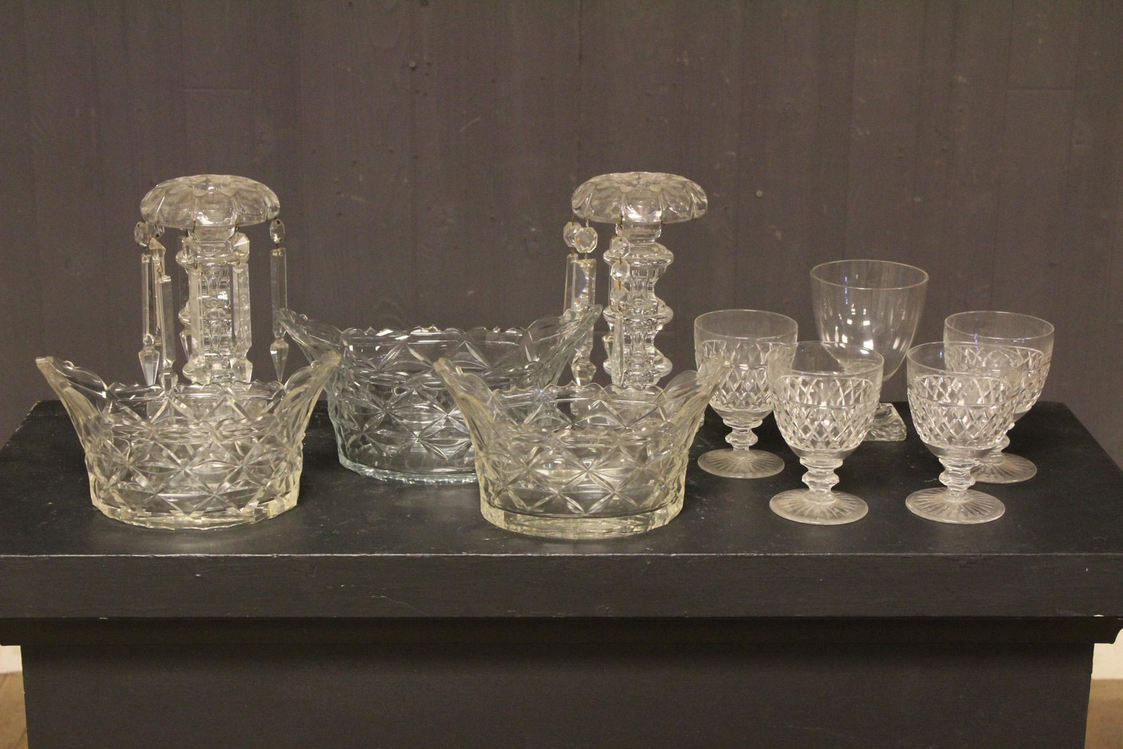 Assorted Glassware: Assorted Glassware includes a set of 3 center bowls, set of 4 wine glasses, pair of girandole lamps with prisms, and an additional wine glass. Size: Largest: 5.5" H x 11" W x 5.75" D.