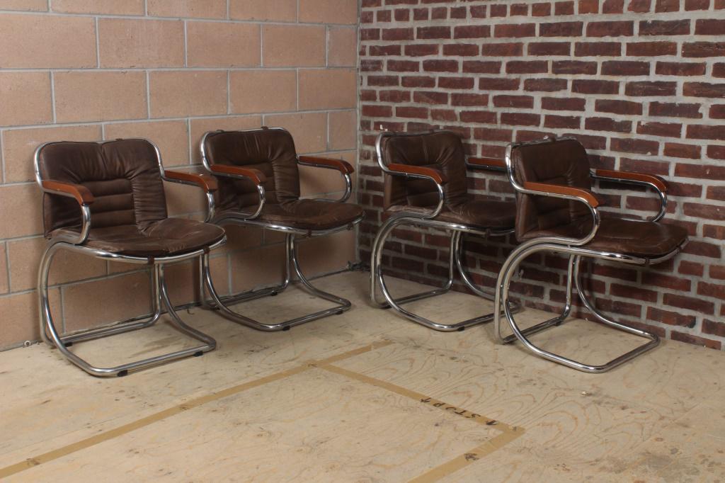 4 Chrome and Leather Armchairs: 4 Chrome and Leather Armchairs. Size: 30" H x 21.5" W x 22" D