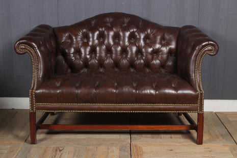 Tufted Leather Camelback Settee: Tufted Leather Camelback Settee. Chippendale style. Size: 35" H x 58" W x 30" D