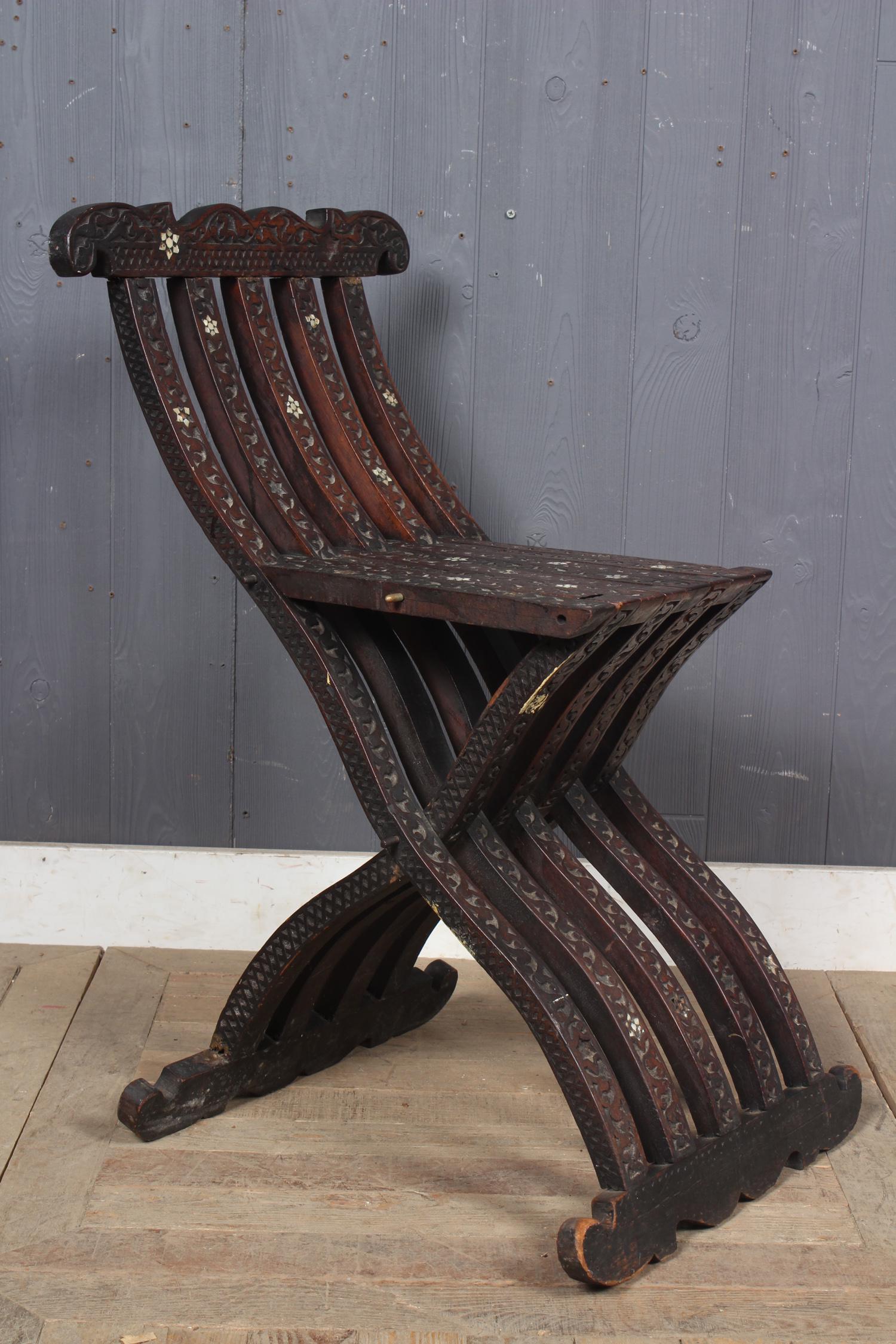 Moroccan Carved and Shell Inlaid Folding Chair: Moroccan Carved and Shell Inlaid Folding Chair. Size: 31" H x 18" W x 21.5" D
