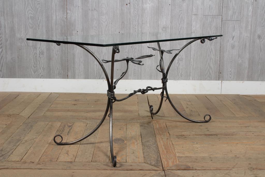 Floriform Wrought Iron Glass Top Table: Floriform Wrought Iron Glass Top Table. Size: 21.5" H x 42" W x 18" D