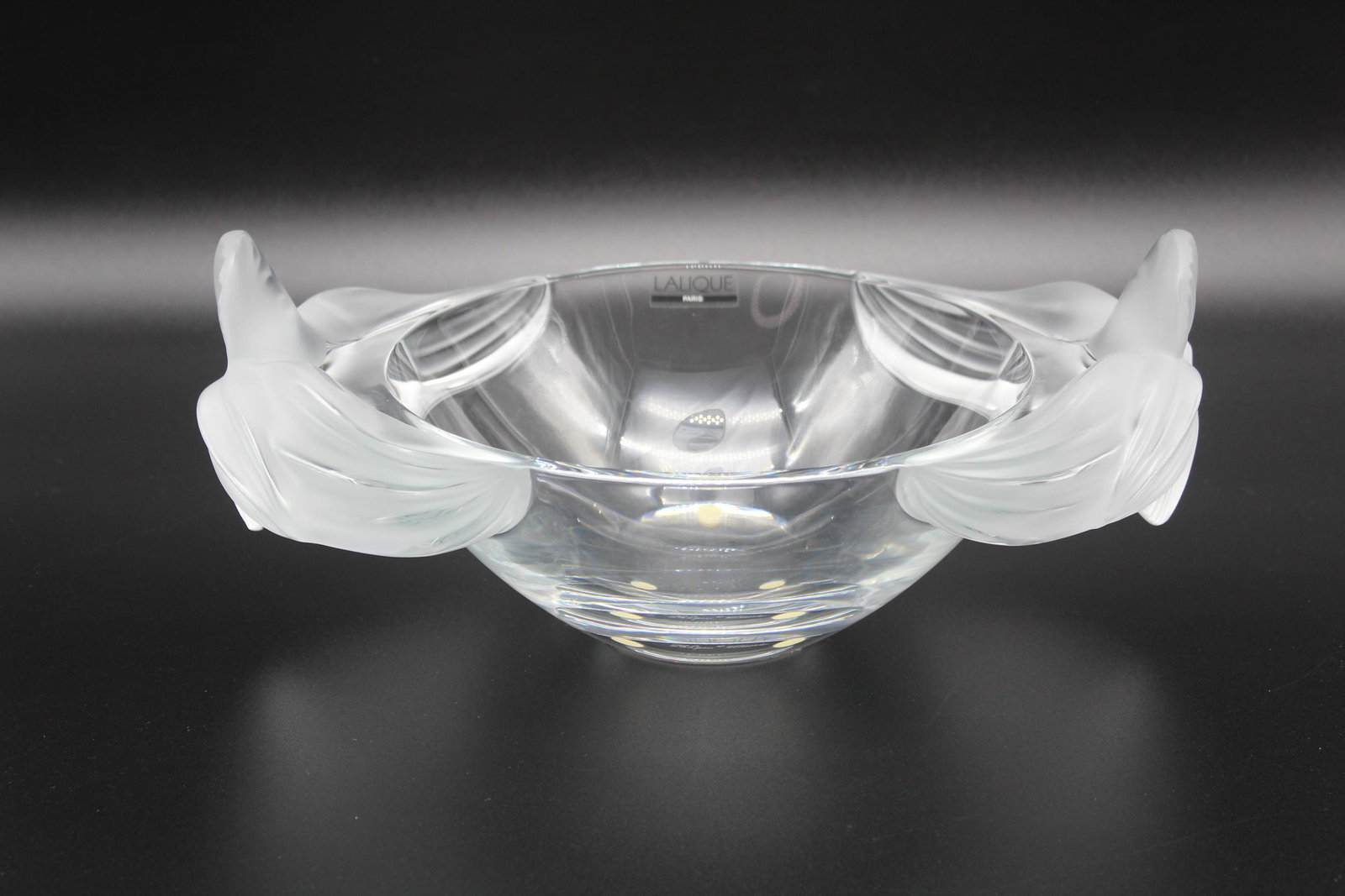 Lalique Loriol Crystal Oval Bowl: Lalique Loriol Crystal Oval Bowl, glass center bowl with frosted orchids, Lalique France script signature on bottom, Lalique Paris label on side. Size: 5" H x 12.5" W x 8.5" D.