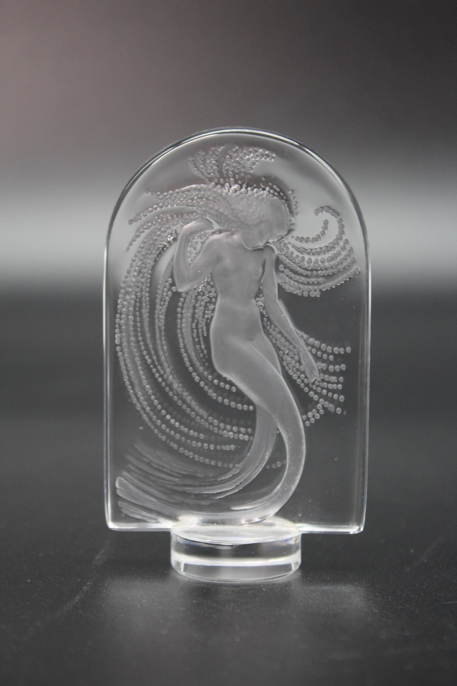 Lalique Naiade Crystal Figurine: Lalique Naiade Crystal Figurine, Lalique France script signature along side of base. Size: 3.75" H x 2.25" W x 1" D.