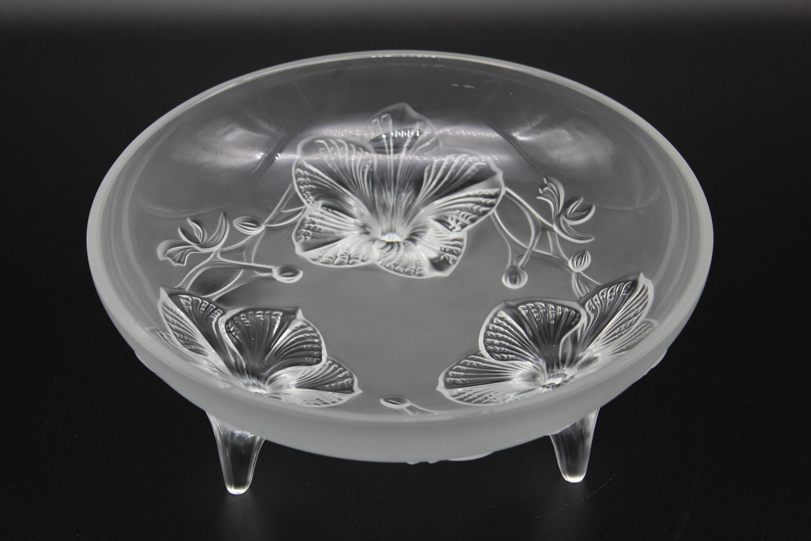Lalique Crystal Floral Center Bowl: Lalique Crystal Floral Center Bowl, clear and frosted glass three legged bowl, similar to the Lys bowl, Lalique France script signature on leg. Size: 4" H x 9.25" Diameter.
