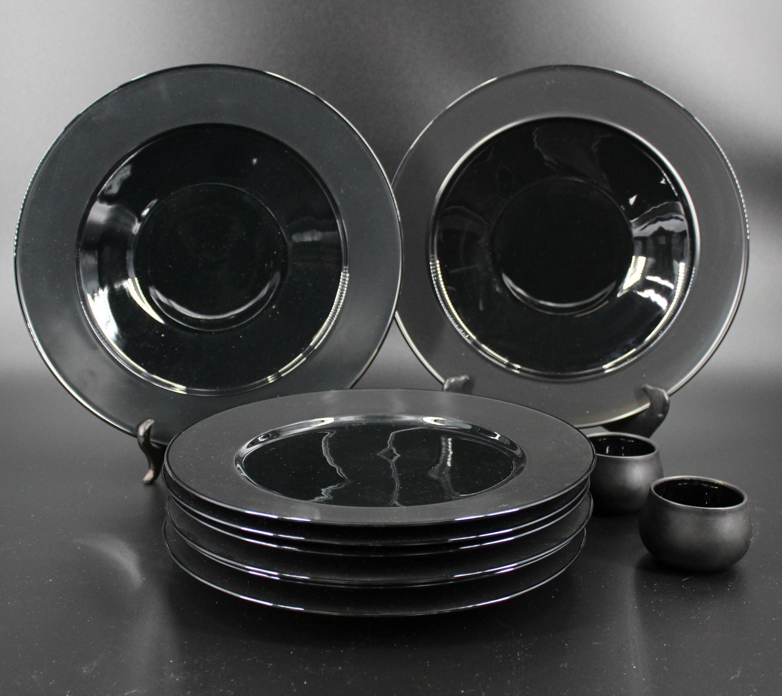 Rosenthal Porcelain Noire Plates and Bowls: Rosenthal Porcelain Noire Plates and Bowls, designed by Tapio Wirkkala, includes six dinner plates, 11" diameter, two bowls, 12" diameter, and two ramekins, 2" H.