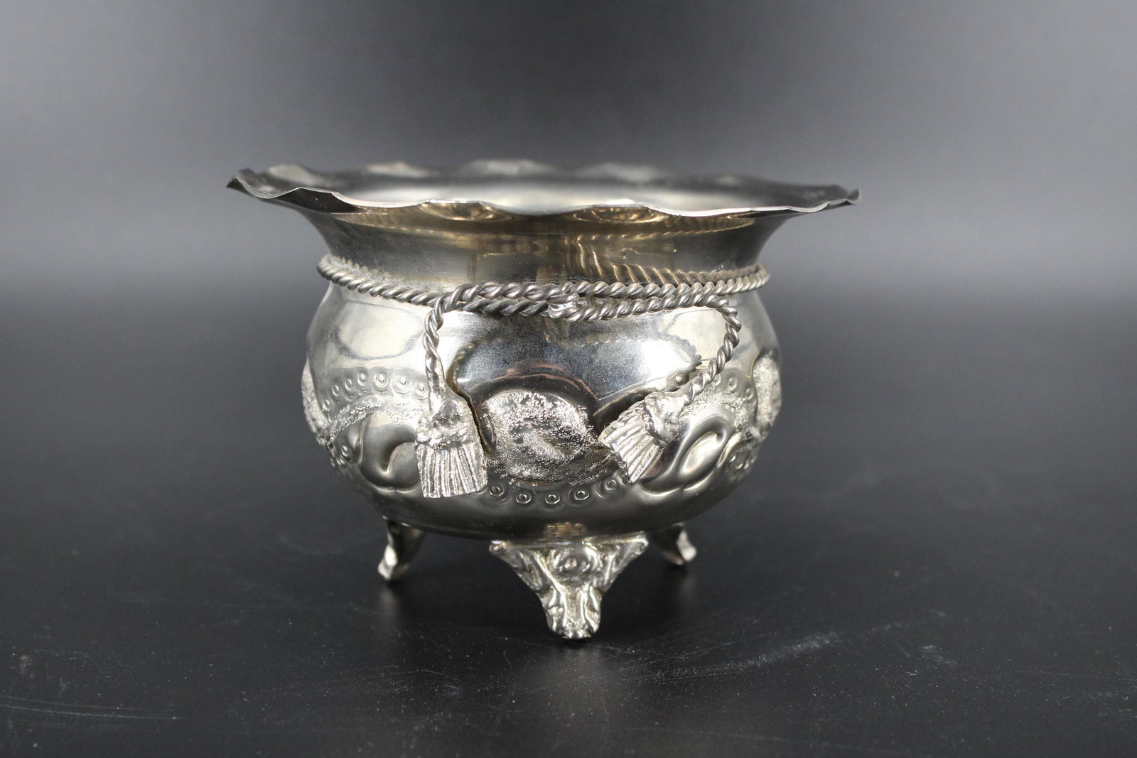 Handwrought Chased Metal Cachepot: Hand wrought chased metal cache pot, chased design, with rope decoration, three feet, engraved on bottom "Chahe & Leta 21-8-2005". Size: 3.5" H x 5.25" Diameter.