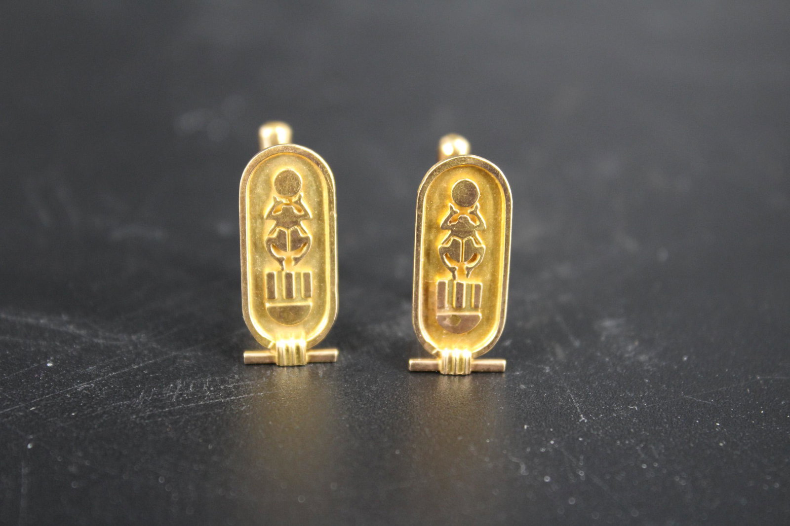 Egyptian 18K Gold Cuff Links: Egyptian 18K Gold Cuff Links, Hieroglyphic cartouche, stamped with a Middle Eastern gold hallmark, weighs 10.4 grams/ 6.7 dwt. Size: 1" H x 0.5" W x 0.75" D.