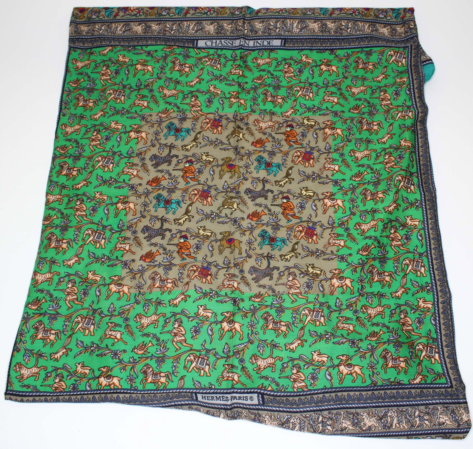 Hermes Chasse en Inde Cashmere & Silk Shawl: Hermes Chasse en Inde Cashmere & Silk Shawl, green border, designed by Michel Duchene, Made in France. Size: 53" H x 52" W.