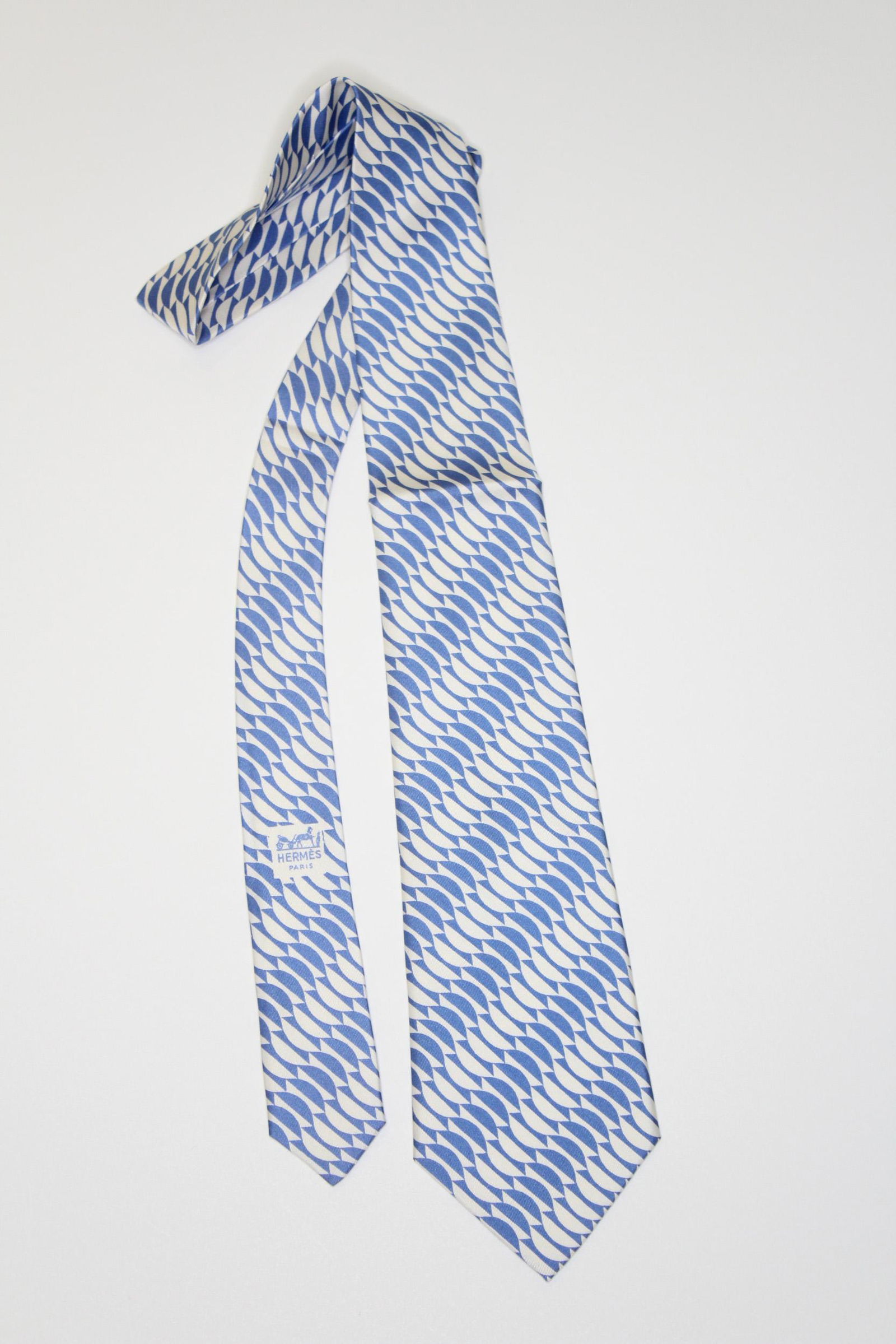 Hermes Paris Blue and White Silk Tie: Hermes Paris Blue and White Silk Tie, labeled, Made in France 294 MA. Size: 53" L x 3.5" W.