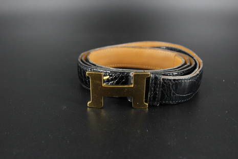 Hermes Black Crocodile Belt with Constance Buckle: Hermes Black Crocodile Belt with Constance Buckle, reversible black and brown leather, marked Hermes on buckle, stamped Hermes Paris Made in France on belt. Size: 44" L x 1" W.