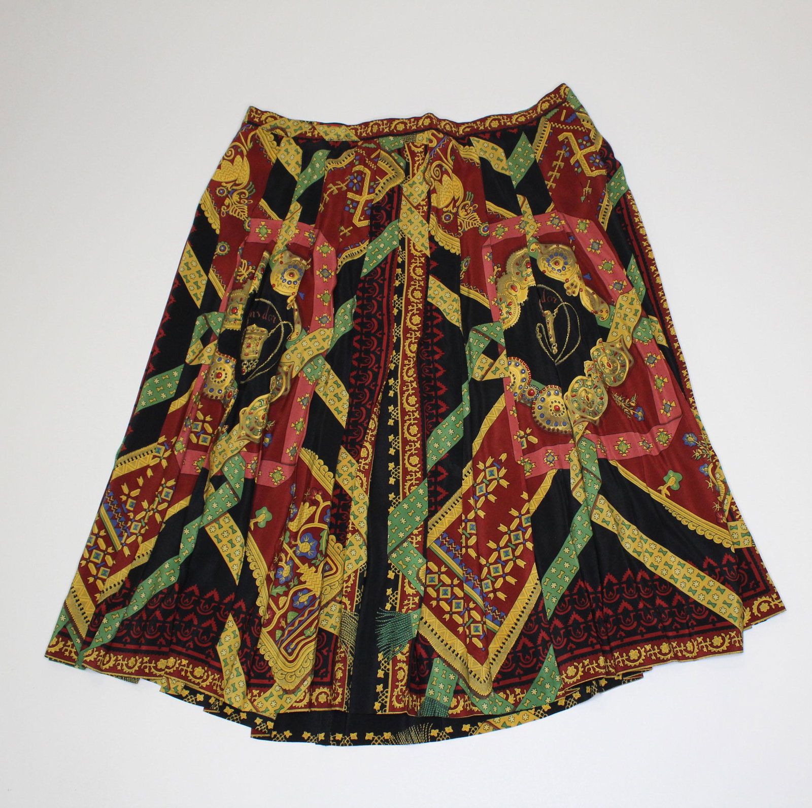 Hermes Torins D'or Silk Skirt: Hermes Torins D'or Silk Skirt, attributed to Hermes, pleated skirt, Hermes Paris in print, not labeled, black ground, zipper and hook closure, measures 35" waist, 27" waist to hem.
