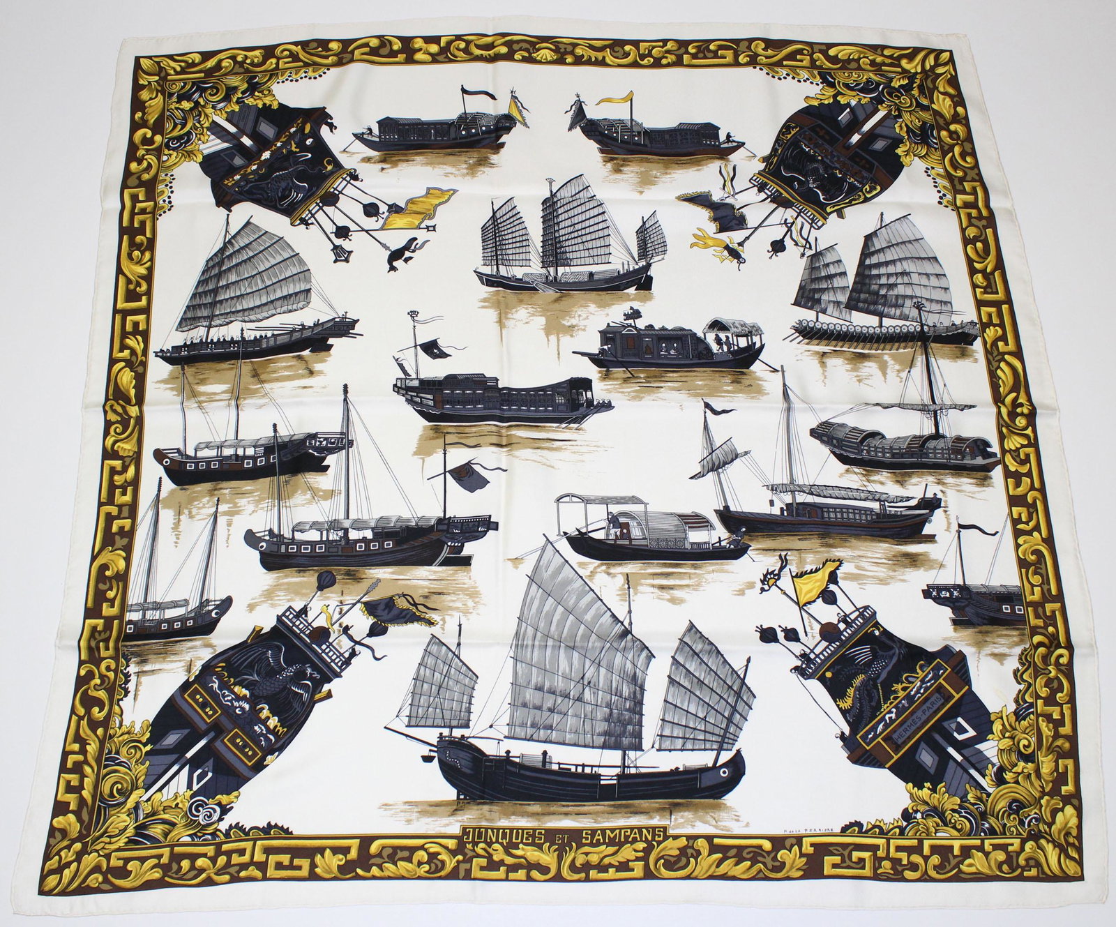 Hermes Jonques et Sampans Silk Scarf: Hermes Jonques et Sampans Silk Scarf, white ground with brown and gold border, designed by Francoise de la Perriere. Size: 35" H x 35" W.