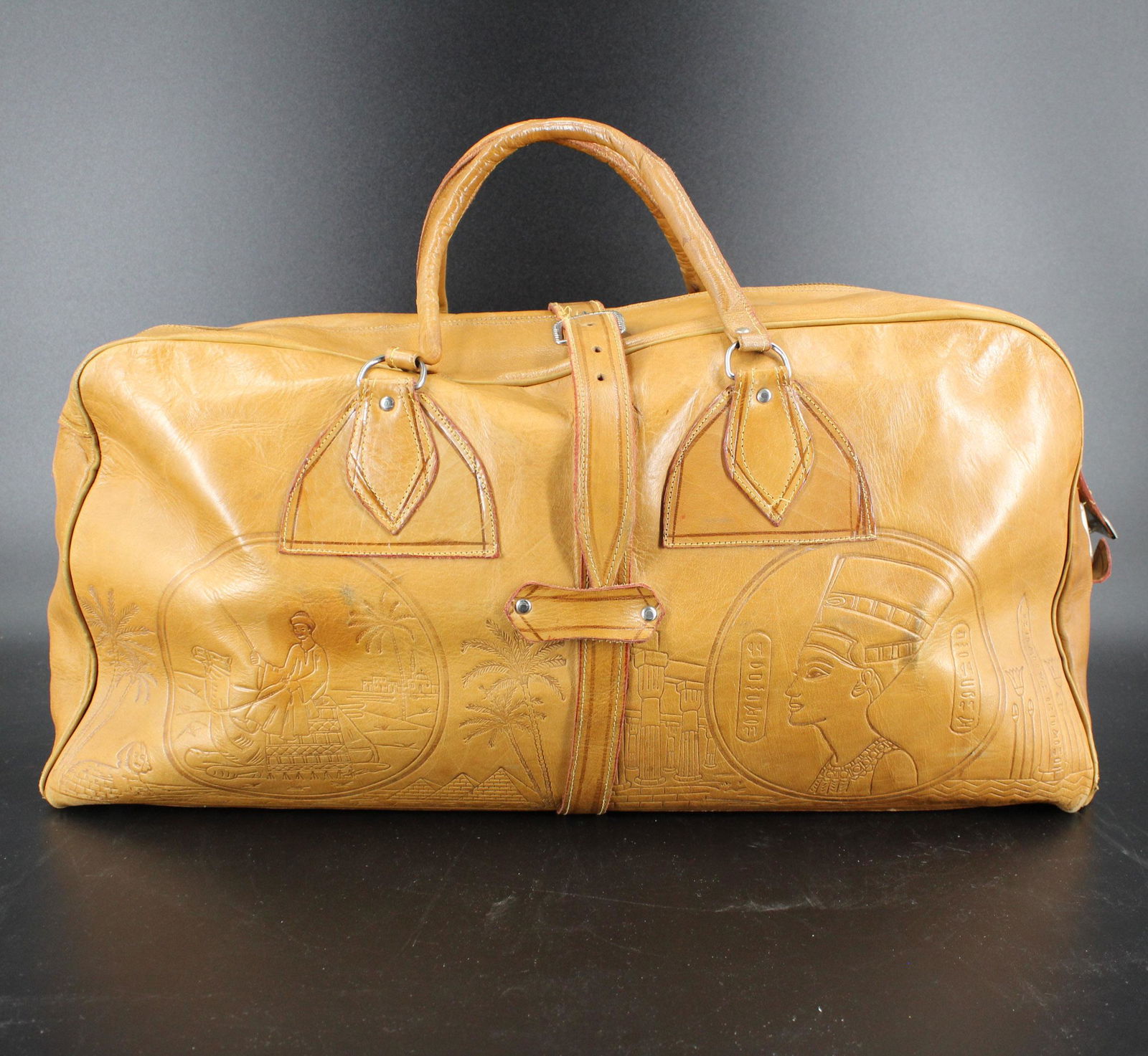 Vintage Egyptian Embossed Leather Duffle Bag: Vintage Egyptian Embossed Leather Duffle Bag. Size: 10" H x 21" W x 7" D.