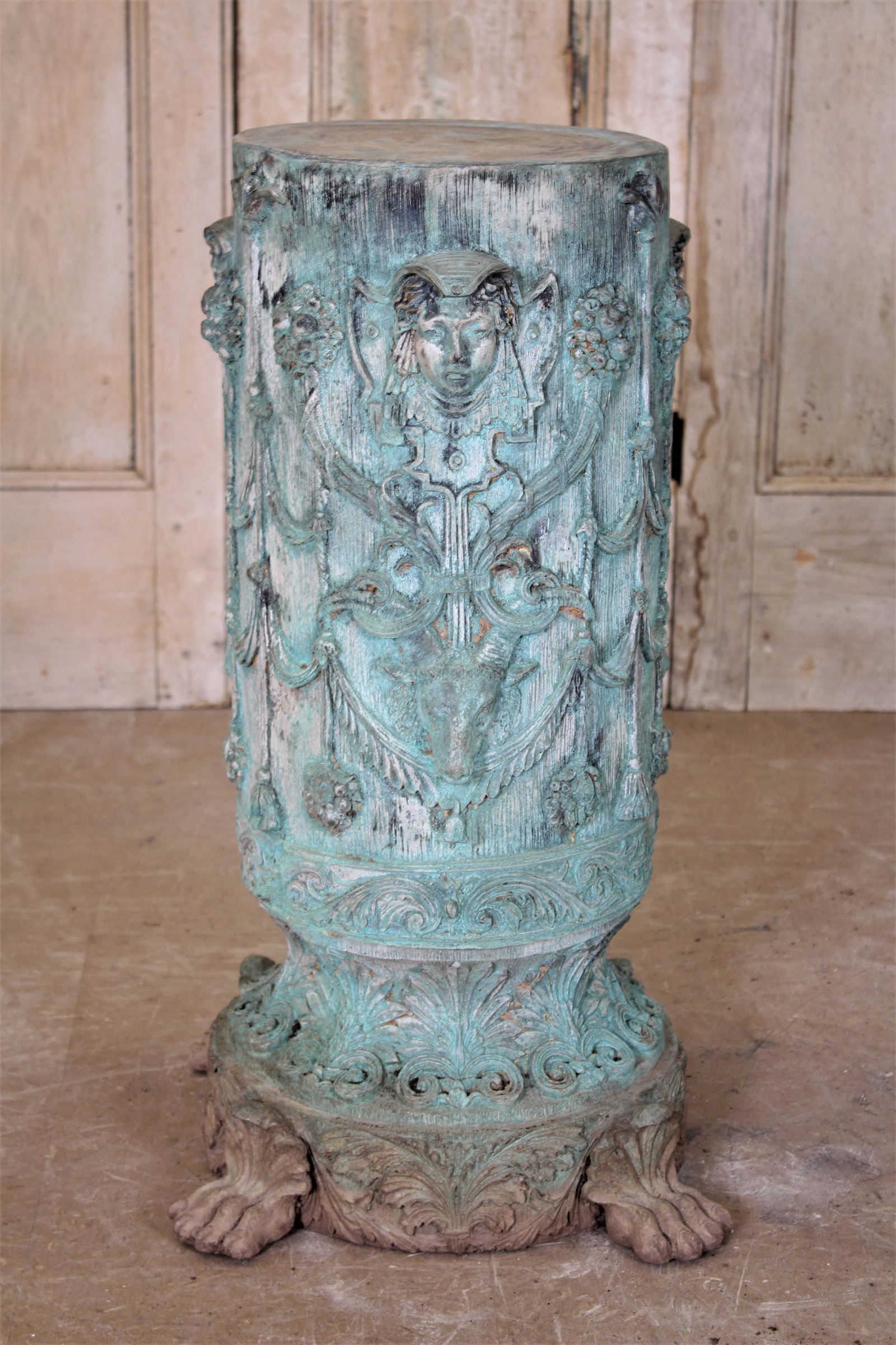 Bronze Faux Bois Pedestal: Bronze Faux Bois Pedestal, figural and floral decorated pedestal with paw feet. Size: 34" H x 19" W x 19" D.