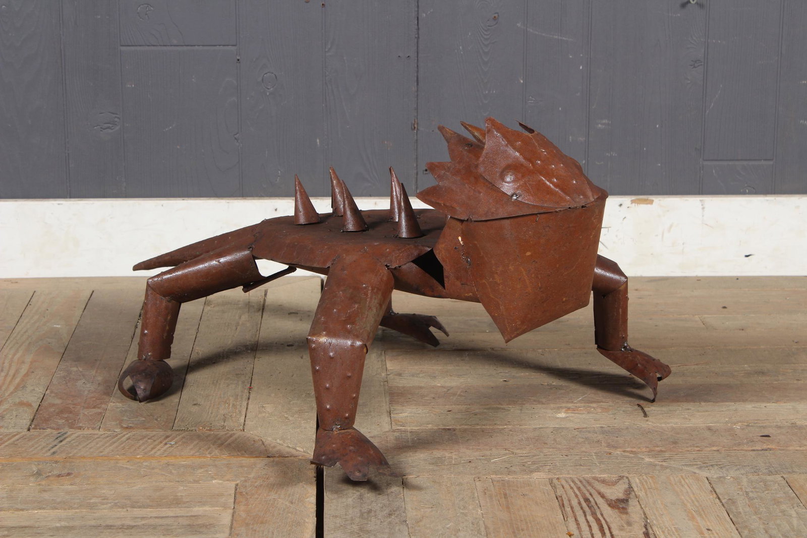 Folk Art Steel Bearded Dragon Garden Sculpture: A whimsical folk art metal horn toad with spiked back Size: 13.5" H x 21" W x 31" D