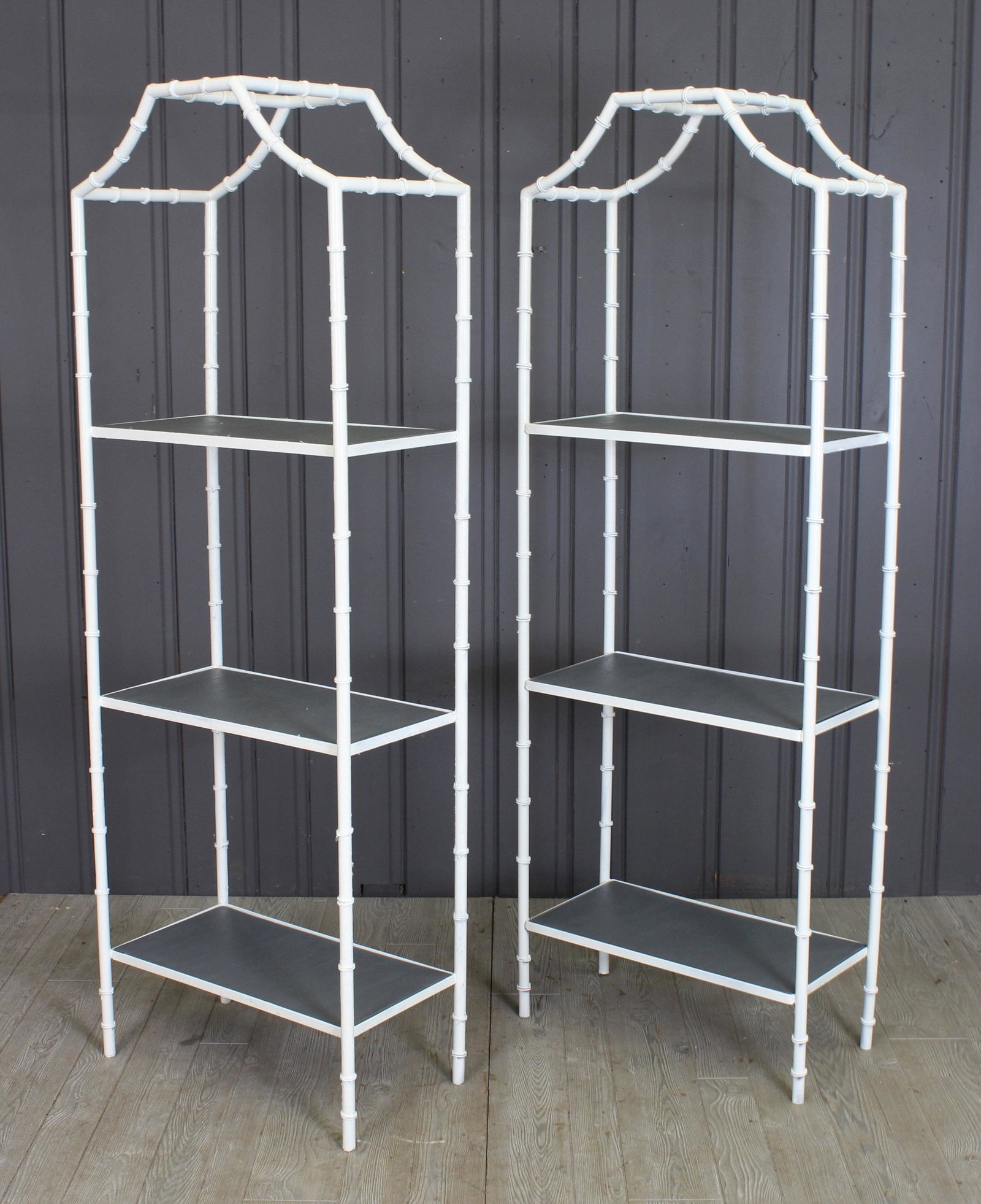 2 Pagoda Form Faux Bamboo Metal Etegeres: A pair of vintage wrought iron faux bamboo pagoda from etegeres. 73" x 26" 14"