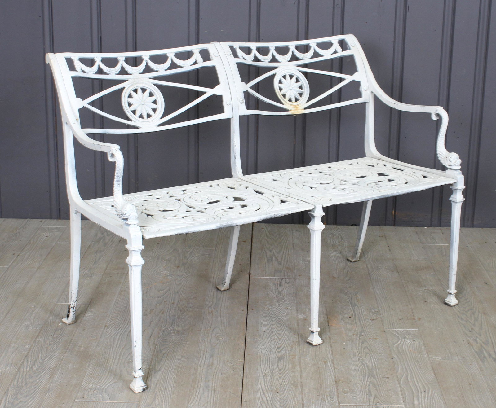 Neo Classical Garden Bench: A stylish cast aluminum garden bench having draped garland and dolphin decoration. Size: 31"H x 43"W x 17"D