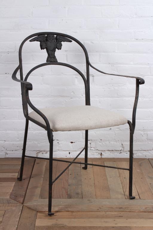 Morgan Colt Arm Chair: A Morgan colt wrought iron open arm chair having cast iron spread wing owl decoration, circa 1905-1910. Older paint finish with some surface rust and wear. Size: 34" H x 25 1/2" W x 21 1/2" D