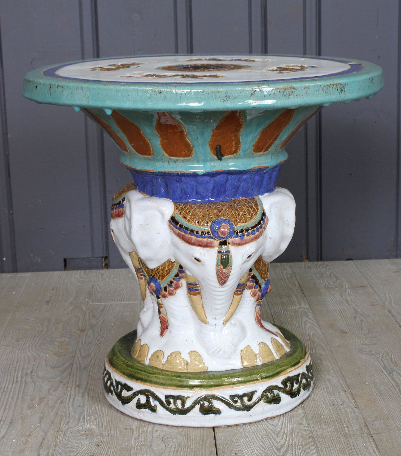 Glazed Earthenware Garden Table: A charming glazed earthenware garden table with decorated top and elephant base. Size: 21.5H x 22.5"dia.