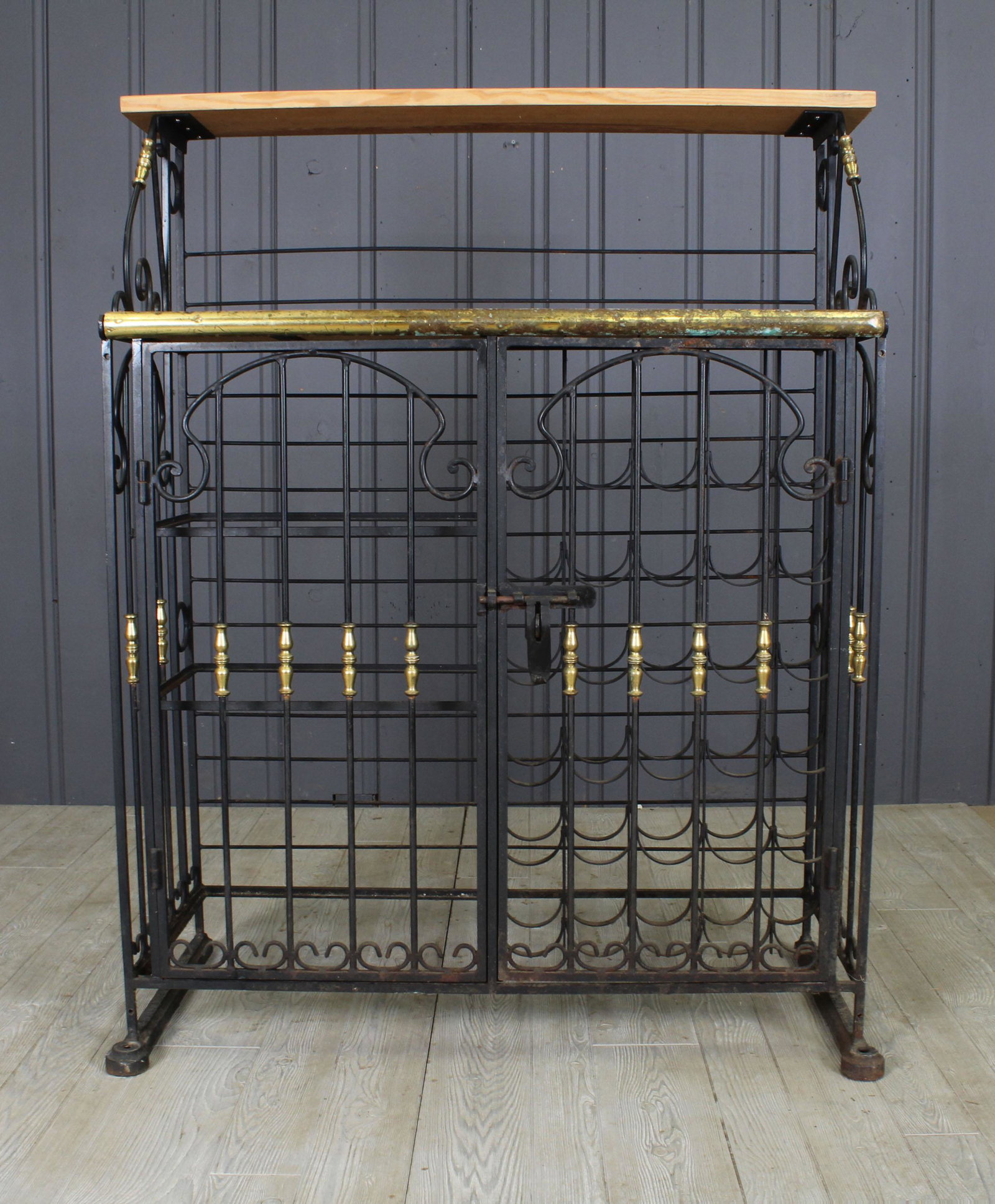 French Wine Locker: A labeled Perfit Fils Ltd. Paris wrought iron and brass wine locker with wood shelves over two doors. Size: 56"H x 42"W x 19"D