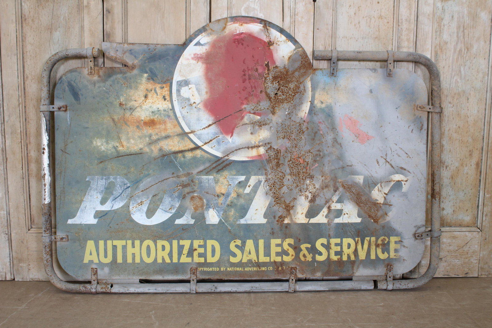Vintage Pontiac Sheet & Wrought Metal Adv Sign: Vintage Pontiac Sheet & Wrought Metal Advertising Sign, retaining traditional logo and Pontiac Authorized Sales Service, double sided. Size: 50.5" H x 71" W.