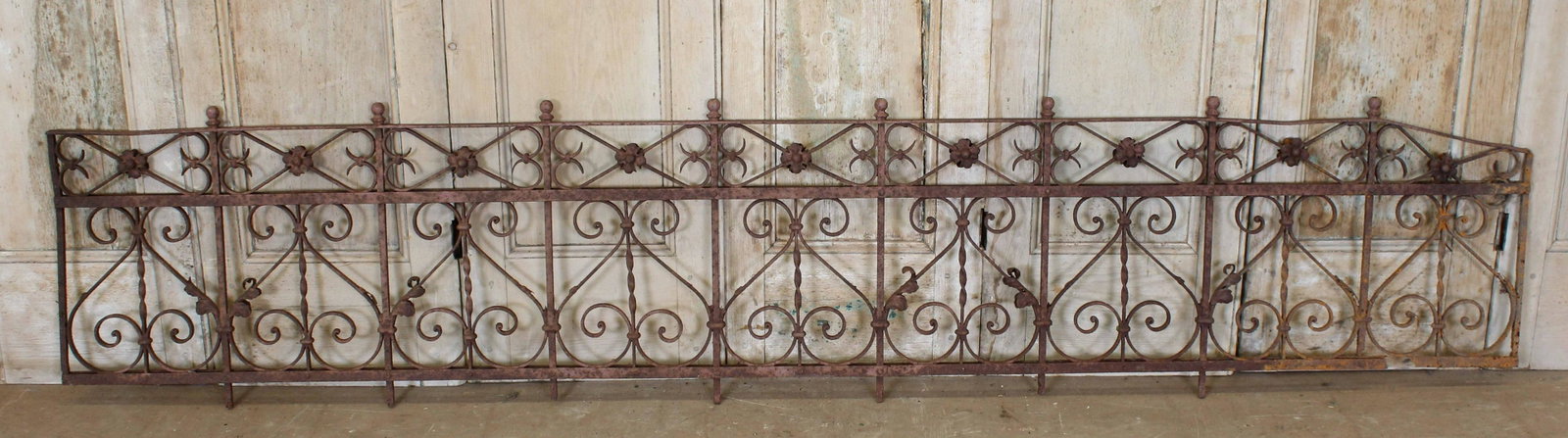 Architectural Cast Iron Widow's Walk panel: A late 19th century wrought iron panel with scroll and floral decoration. 22" x 101"