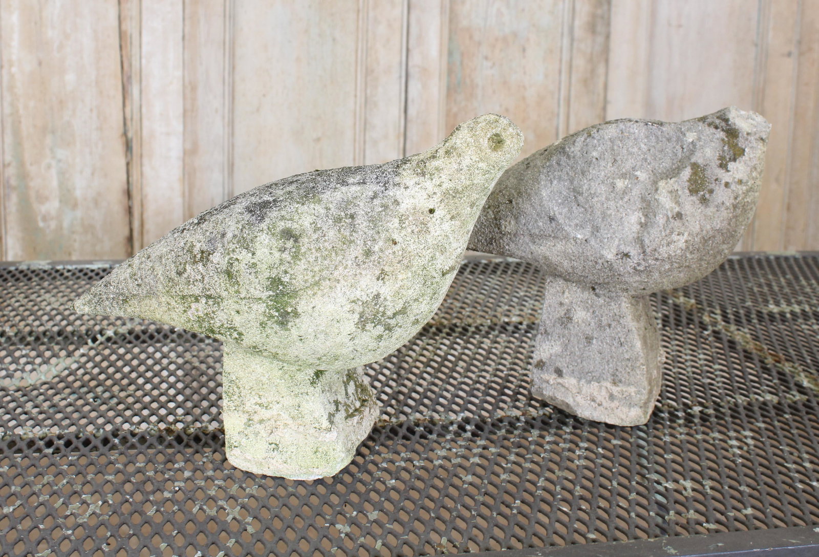 Pair French Concrete Birds: A pair of French carved stone stylized birds, great for the garden . Size: 10" H x 13" W x 7" D.