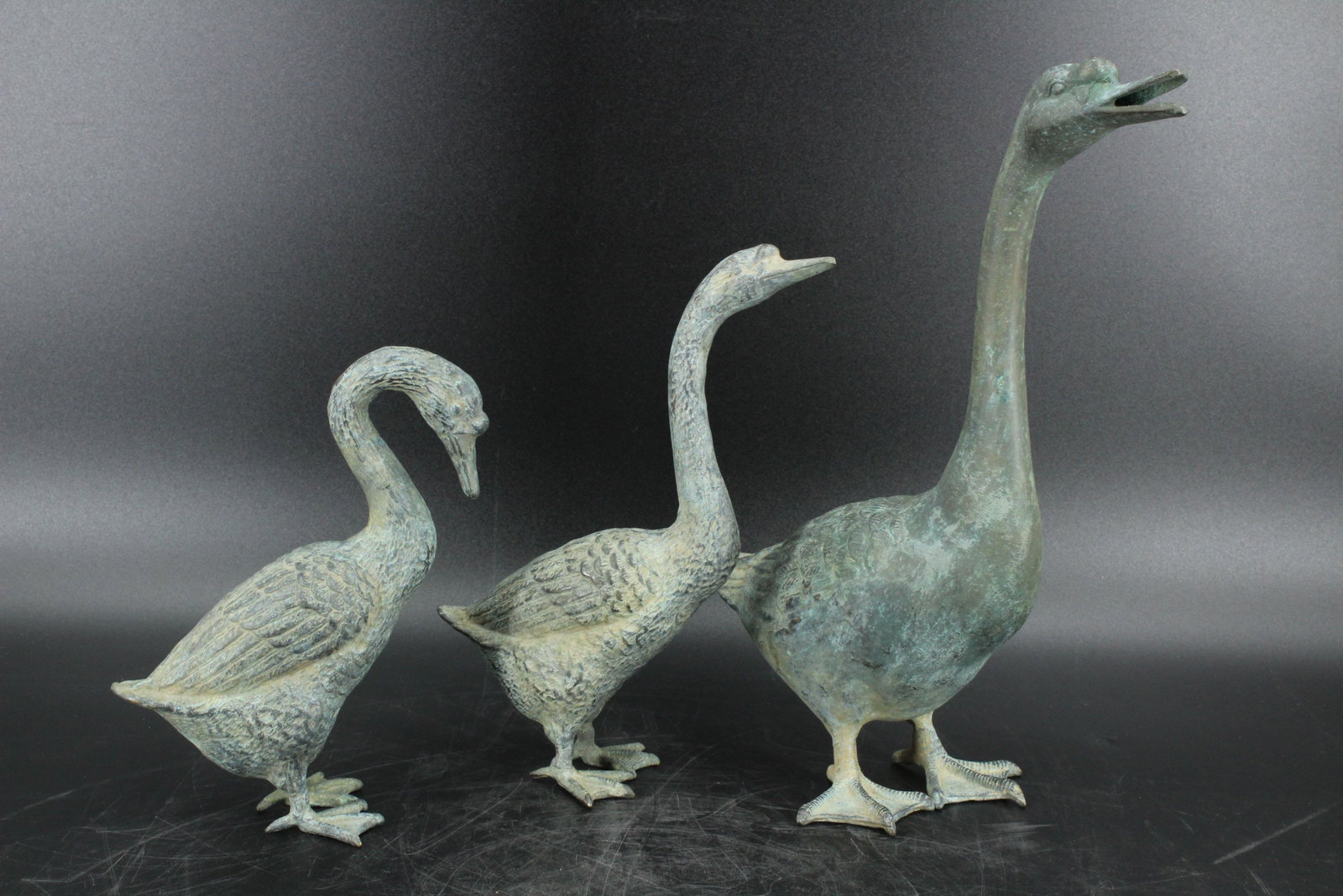 3 Bronze Geese Sculptures: 3 Bronze Geese Sculptures. Size: 14"H x 4"W x 12"D